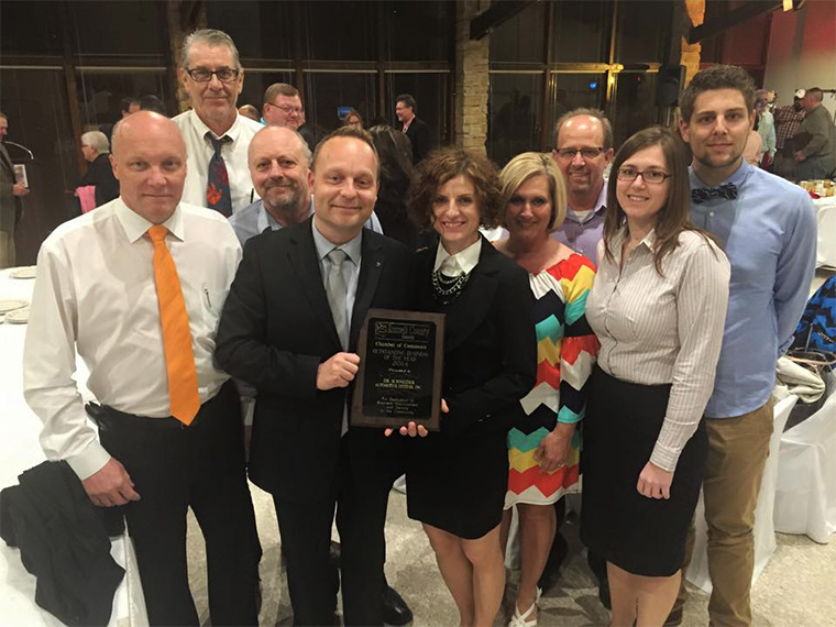 photo of Dr. Schneider team receiving Outstanding Business of the Year